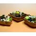 Front of three handmade acacia bowls displaying a green and natural colored blend of botanicals. Bowl shapes are square, leaf, and flare.